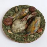 A Portuguese Pallisy Majolica grotesque wall plate, monkfish and shellfish decoration, stamped