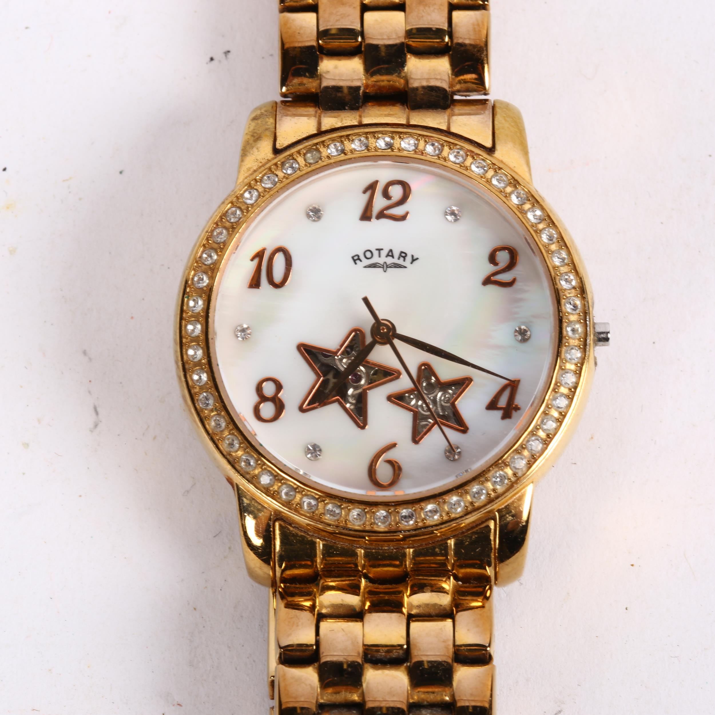ROTARY - a lady's gold plated stainless steel automatic wristwatch, mother-of-pearl dial with CZ