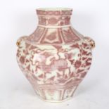 A Chinese octagonal vase, with mask handles