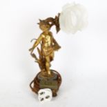After Auguste Moreau, a gilded spelter figural table lamp, with frosted flowerhead shade and