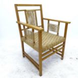 Wilhelm Schmidt, attributed, an early 20th century oak armchair with cord seat, in the manner of