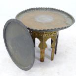 An Eastern design copper and brass tray-top table, on lacquered base, D70cm, H56cm, and another