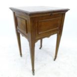 A reproduction mahogany metamorphic dressing/occasional table, with fold-out rising interior, W54cm,