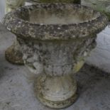 A weathered concrete circular garden urn on stand, D54cm, H65cm