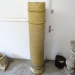 A tall terracotta chimney pot, H153cm
