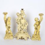 A set of 3 Classical style painted resin cherub candlesticks, largest height 38cm