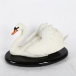 A Franklin Mint fine bisque porcelain 'The Royal Swan' figure, by Ronald Van Ruyckevelt, on