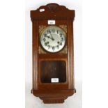 A Vintage stained oak 8-day drop-dial wall clock, case height 55cm, with pendulum