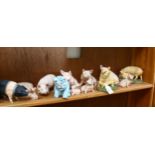 A group of various porcelain pig ornaments, including Ainsley (13)