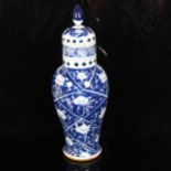 A Chinese blue and white baluster jar and cover, height 34cm Top rim has a faint 4cm hairline crack,