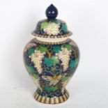 A Chinese lavender ground butterfly and grape baluster jar and cover, character marks on base,