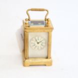 A reproduction miniature brass-cased carriage clock, height 6cm