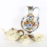 A hand painted Delft ewer, height 30cm, and a Belleek third mark teapot, sugar bowl and single tea