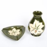MOORCROFT - a matching Bermuda Lily pattern ovoid vase and ashtray, vase height 14cm (2) Vase has