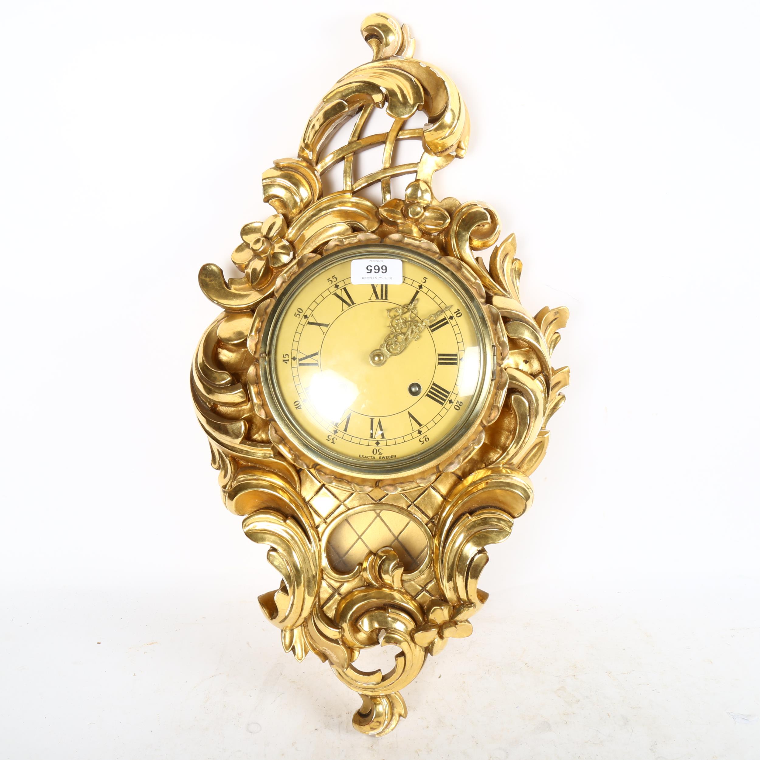 A reproduction gilt-gesso Cartel clock, with 8-day movement, by Exacta, Sweden, height 60cm