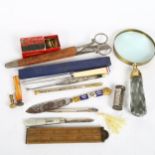 Various collectables, including glass-handled magnifying glass, silver-bladed mother-of-pearl