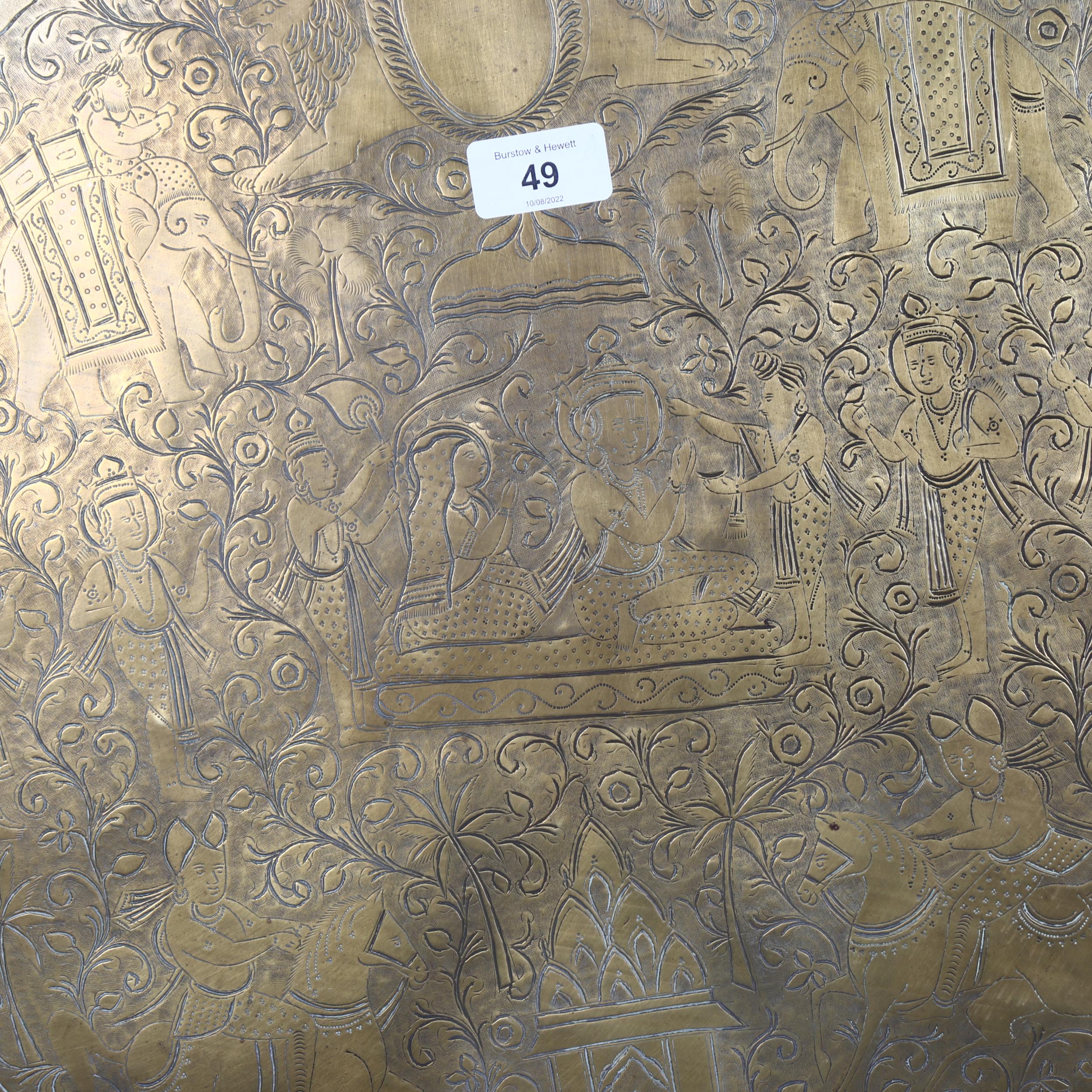 A large Indian engraved brass tray, with lobed border and figural decoration, diameter 73cm - Image 2 of 2