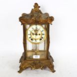 A Victorian gilt-brass 4-glass 8-day mantel clock, with enamelled dial and Roman numerals,