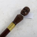 A turned wood walking stick, with phrenology head knop, length 90cm