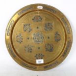 A Turkish brass charger, with silvered and brass embossed decoration, width 35cm