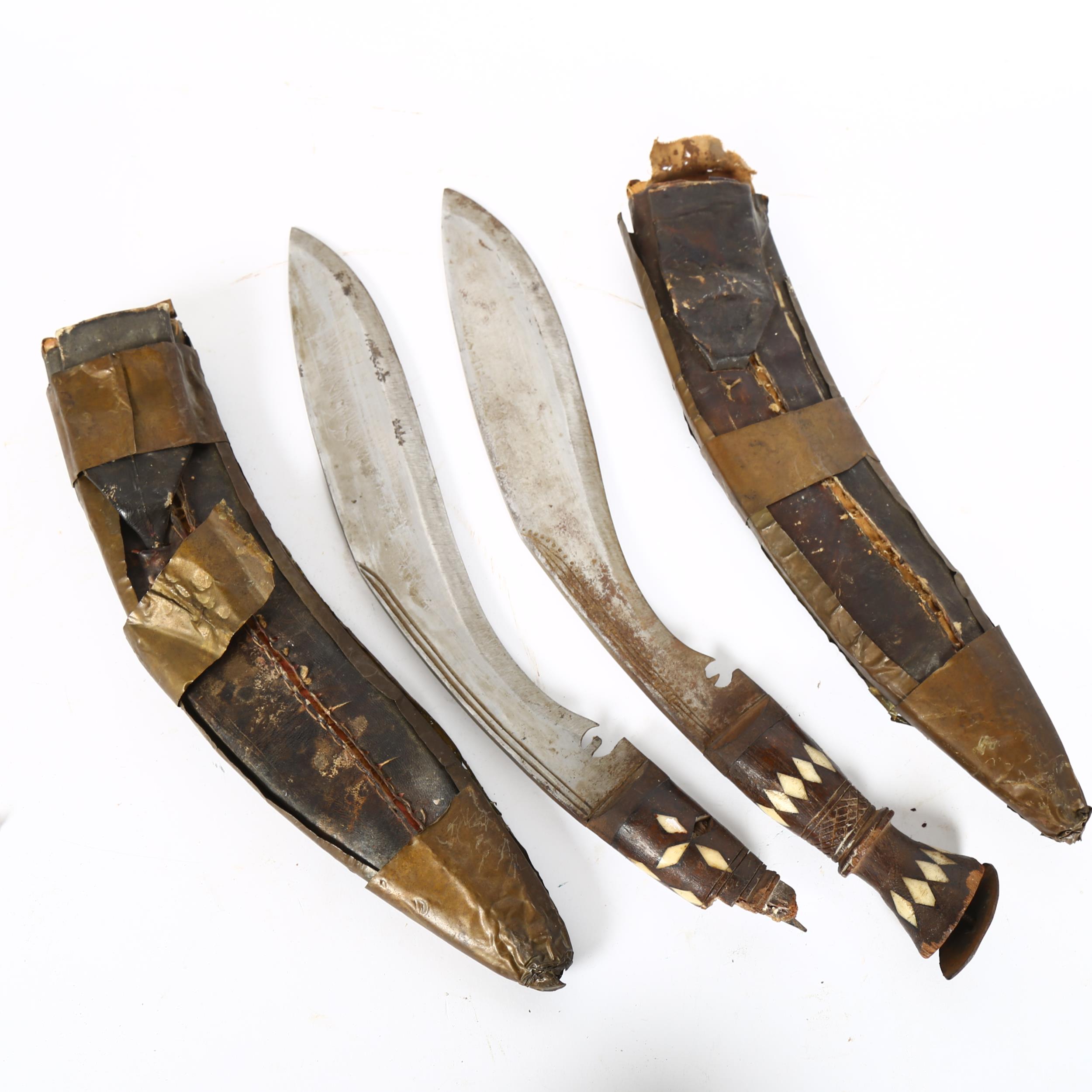 A pair of Indian kukri knives, with gem set brass-mounted scabbards and bone handles, blade length - Image 2 of 2