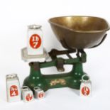 A set of green cast-iron balance scales, by G Perry & Sons of Southend, with a graduated set of