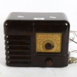 An Art Deco Portadyne Universal Bakelite valve radio, width 25cm
