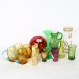 A group of coloured glassware, including a set of 4 amber mugs, enamel decorated jugs, French
