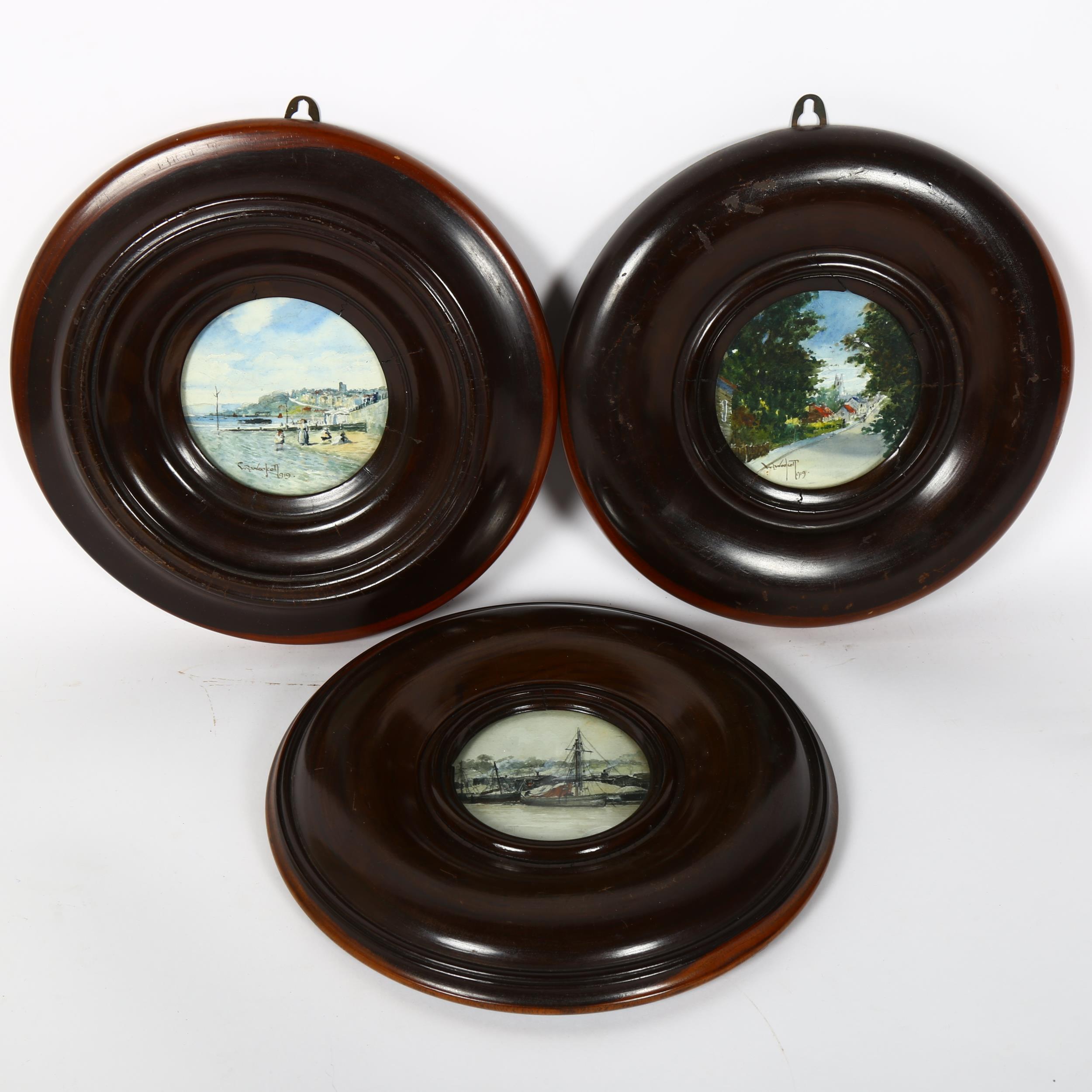 A set of 3 turned lignum vitae circular picture frames, overall diameter 26cm (3)