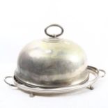 A silver plate on copper galleried tea tray on cast paw feet, and a plated meat cover