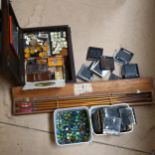 A cased set of target arrows, glass marbles, magic lantern slides etc