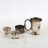 A pair of miniature silver salts, a silver napkin ring, and a small silver tankard