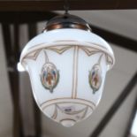 An early 20th century pendant light fitting, with painted glass shade and copper mounts, shade