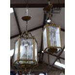 2 brass-framed glass ceiling lanterns, largest height 60cm