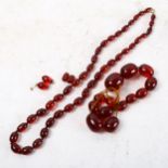 2 red Bakelite bead necklaces and a pair of matching earrings