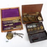 A 19th century mahogany-cased draught set, Bakelite-cased weights, and 2 sets of small balance