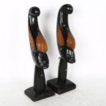 A pair of African Tribal carved wood busts on stand, tallest 46cm