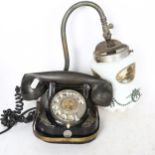 An Edwardian wall-mounted gas light, with milk glass shade, and a Bell dial telephone