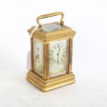 A miniature reproduction brass carriage clock, height 7.5cm not including handle