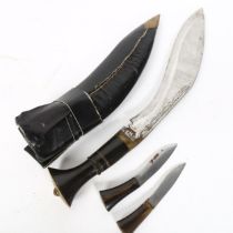 An Indian kukri knife and scabbard, with miniature knives and bone handles, blade length 28cm