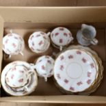 A ceramic tea set for 10 people, white ground decorated with flowers (pattern 227?)