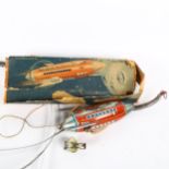 A Vintage German Mondrakete tinplate clockwork sky/rocket toy, with parachuting figure, boxed,