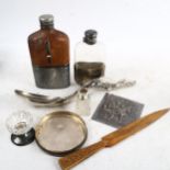2 hip flasks, 1 leather-covered, a tavern scene plaque, an Eastern white metal serving spoon etc