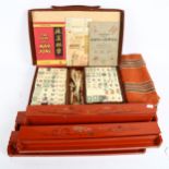 A Chad Valley Mahjong bone and bamboo set, cased with stands