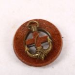 A Victorian gold stone brooch, with central anchor motif