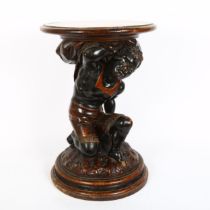 A 19th century carved and stained oak Blackamoor figure pedestal, height 50cm, diameter 34cm Base