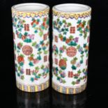 A pair of Chinese famille verte fruit cylinder vases, marks on bases, height 28cm No chips cracks or