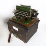 An early 20th century Imperial portable green typewriter, cased
