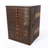 A Vintage stained pine carpenter's table-top graduated chest of drawers, W29cm, H39cm, D27cm