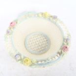 A Belleek delicate pierced latticework basket, with applied flowers, width 22cm